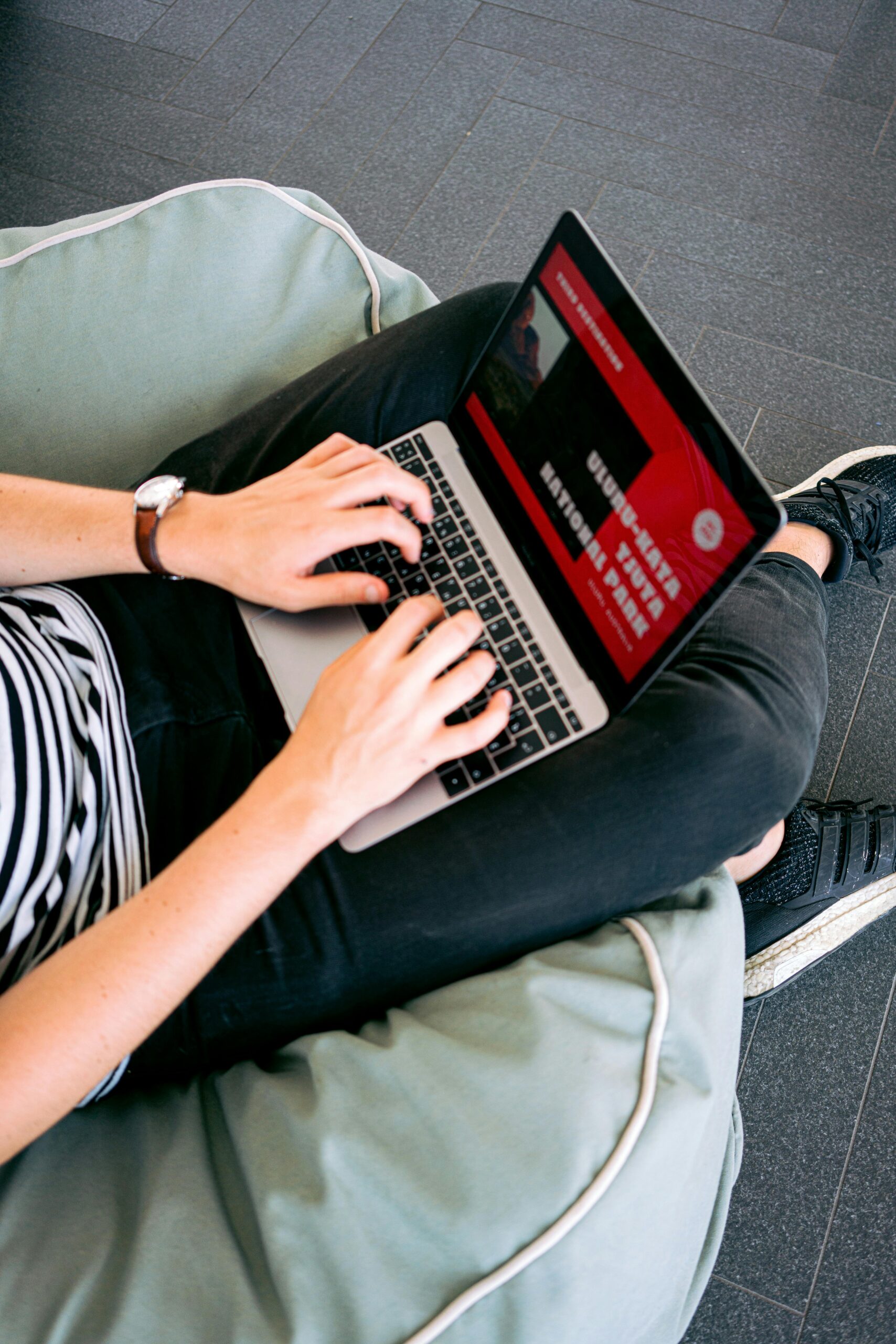 person on a laptop designing a website